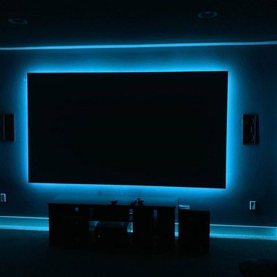 Zero Edge Projector Screen w/ LEDs - The Zero Edge Protector Screen from Screen Innovations is already impressive, but we added their LED lighting kit and brought this home theater to a whole new level. We’re always looking for new ways to make our client’s home entertainment dreams a reality. Coupled with seven in-wall and in-ceiling Klipsch zero-bezel speakers and all audio produced by a Denon 4300H surround sound receiver this theater really provides a truly immersive experience. Zero Edge Projector Screen w/ LEDs - The Zero Edge Protector Screen from Screen Innovations is already impressive, but we added their LED lighting kit and brought this home theater to a whole new level. We’re always looking for new ways to make our client’s home entertainment dreams a reality. Coupled with seven in-wall and in-ceiling Klipsch zero-bezel speakers and all audio produced by a Denon 4300H surround sound receiver this theater really provides a truly immersive experience.