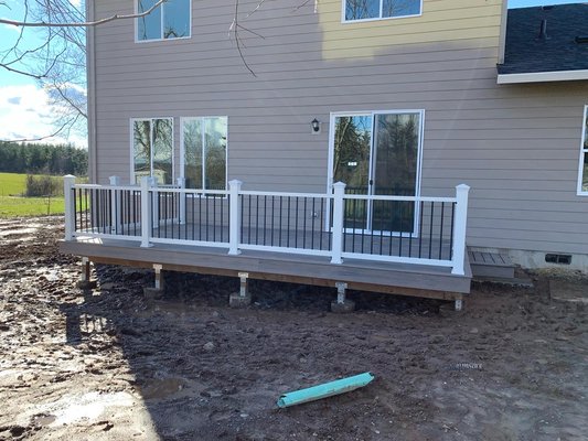 Trex style Deck - This is a great color combo if you are trying to spice up your back patio with a sleek look. Both decking and railing are Trex products. Decking is the Rocky harbor color and the railing is the white with black Trex enhanced baluster kit. Trex style Deck - This is a great color combo if you are trying to spice up your back patio with a sleek look. Both decking and railing are Trex products. Decking is the Rocky harbor color and the railing is the white with black Trex enhanced baluster kit.