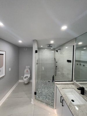 Condo Remodel - This condo was a complete renovation. Updated all cabinets, countertop and backsplash. Removed and installed all flooring throughout the unit. Bathroom renovation with new shower base made from scratch adding in new shower wall tiles as well. Adding can lights through out the unit as well as under lighting with low voltage under cabinet. v