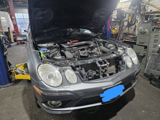 Water Pump Replacement Vehicle: Mercedes-Benz E-350 - We recently performed a critical cooling system overhaul on this Mercedes-Benz E-350 after diagnosing an unusual oil leak originating from the water pump assembly. While water pumps typically circulate coolant, an internal seal failure can allow engine oil—which lubricates the pump's bearings—to seep through the "weep hole," indicating a complete breakdown of the unit's internal integrity. To restore factory performance and ensure long-term reliability, we replaced the compromised unit with a brand-new OEM water pump. This genuine part features a superior impeller design and high-quality alloys that provide the precise flow rates required for Mercedes-Benz high-performance engines. Water Pump Replacement Vehicle: Mercedes-Benz E-350 - We recently performed a critical cooling system overhaul on this Mercedes-Benz E-350 after diagnosing an unusual oil leak originating from the water pump assembly. While water pumps typically circulate coolant, an internal seal failure can allow engine oil—which lubricates the pump's bearings—to seep through the "weep hole," indicating a complete breakdown of the unit's internal integrity. To restore factory performance and ensure long-term reliability, we replaced the compromised unit with a brand-new OEM water pump. This genuine part features a superior impeller design and high-quality alloys that provide the precise flow rates required for Mercedes-Benz high-performance engines.