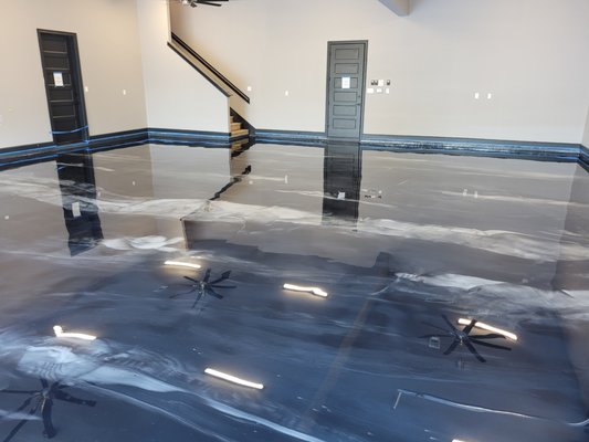 Metallic Floors That Stand Apart! - This client wanted a garage floor that would be as unique as his new home. This garage was 1500 square feet! The client chose black and grey metallics on top of a grey tinted base and the result was amazing, don' you think? Metallic Floors That Stand Apart! - This client wanted a garage floor that would be as unique as his new home. This garage was 1500 square feet! The client chose black and grey metallics on top of a grey tinted base and the result was amazing, don' you think?