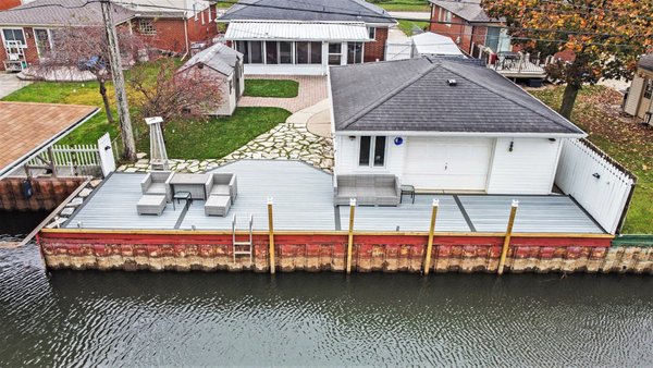 The ultimate waterfront escape in St. Clair Shores! 🌊 - This stunning deck near Lake St. Clair features Trex Foggy Wharf decking boards with a sleek Clam Shell picture frame and parting board for a clean, polished look. Designed to complement the serene waterside views, it’s the perfect spot to relax, entertain, and soak in the beauty of lake life.

Ready to transform your outdoor space into your dream retreat? Let us bring your vision to life!