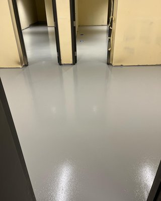 Commercial office building - This commercial office building got our light gray concrete coating system. We added some texture in the finish coat for safety.