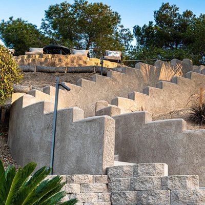Spardy Residence - Looking to take advantage of your backyard? Have a slope you don't know what to do with? Here's an example of what can be done to maximize your backyard and enjoy your outdoor living space. We specialize in everything hardscapes such as concrete, retaining walls, pavers, veneer, stacked stone, firepits, and more! Call us today to see if we're the right fit for you! Spardy Residence - Looking to take advantage of your backyard? Have a slope you don't know what to do with? Here's an example of what can be done to maximize your backyard and enjoy your outdoor living space. We specialize in everything hardscapes such as concrete, retaining walls, pavers, veneer, stacked stone, firepits, and more! Call us today to see if we're the right fit for you!