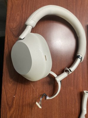 Headset Repair: Hinge Replacement & Cable Soldering - A client’s headset had a broken left hinge. A replacement hinge was ordered, and the internal cables were soldered to restore full functionality. This repair provided a cost-effective solution and extended the headset's life.