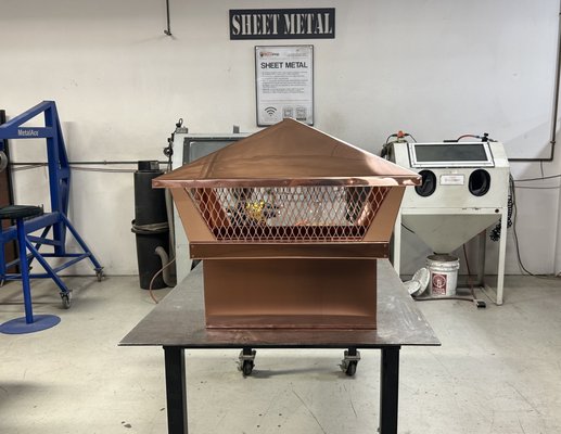 Chimney cap - This cap was made from copper sheet 20 Oz. The assembly was carried out using copper rivets and a folded joint. It was impossible to use soldering, since the fireplace burns wood and has a high exhaust temperature.