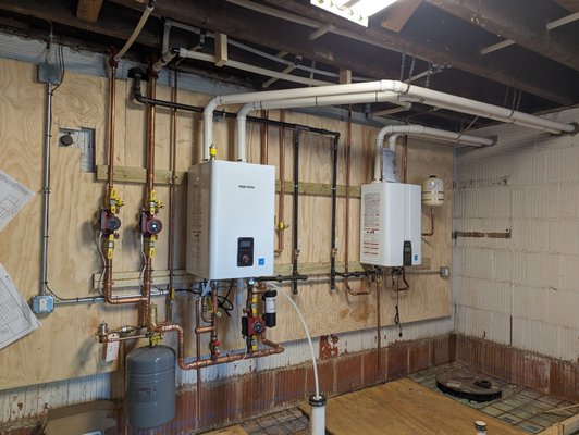 Basement plumbing, water heater & boiler job- - This customer had us re-plumb his basement floor and remove a big old boiler and move all the old steel radiator piping up into the ceiling so he could remodel the whole basement. We moved the boiler and water heater and replaced them with ENERGY STAR rated tankless units- for a nice rebate! We also had to replace all the drain pipes under the basement floor when the original (unlicensed) contractor messed it up. Everything was permitted and inspected as required, and the customer was super happy with the outcome! -Tim Whistler Basement plumbing, water heater & boiler job- - This customer had us re-plumb his basement floor and remove a big old boiler and move all the old steel radiator piping up into the ceiling so he could remodel the whole basement. We moved the boiler and water heater and replaced them with ENERGY STAR rated tankless units- for a nice rebate! We also had to replace all the drain pipes under the basement floor when the original (unlicensed) contractor messed it up. Everything was permitted and inspected as required, and the customer was super happy with the outcome! -Tim Whistler
