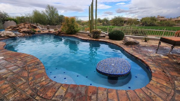 Swimming pool and spa remodel. - This remodel was completed in beautiful Mesa Arizona. Our homeowners wanted to bring new life into their swimming pool and spa. We chipped out the old outdated Plaster in the pool and spa and we installed new waterline tile in the pool and spa. The homeowners picked out Pebble Sheen Aqua Blue for their interior. Everything came out perfect and our homeowners love their pool and spa. Swimming pool and spa remodel. - This remodel was completed in beautiful Mesa Arizona. Our homeowners wanted to bring new life into their swimming pool and spa. We chipped out the old outdated Plaster in the pool and spa and we installed new waterline tile in the pool and spa. The homeowners picked out Pebble Sheen Aqua Blue for their interior. Everything came out perfect and our homeowners love their pool and spa.