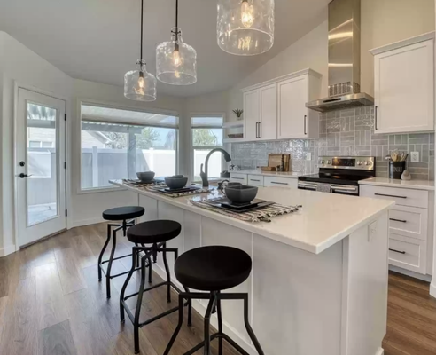 Kitchen Remodel - This kitchen, underwent a total remodel. Starting with the space being gutted to the studs, Juje Co., hand picked each piece to make this work of art complete. With a unique backsplash, and clean bright colors, this kitchen brings in so much more light. Our favorite part of this project were the giant glass light pendants, beaming over the island. Kitchen Remodel - This kitchen, underwent a total remodel. Starting with the space being gutted to the studs, Juje Co., hand picked each piece to make this work of art complete. With a unique backsplash, and clean bright colors, this kitchen brings in so much more light. Our favorite part of this project were the giant glass light pendants, beaming over the island.