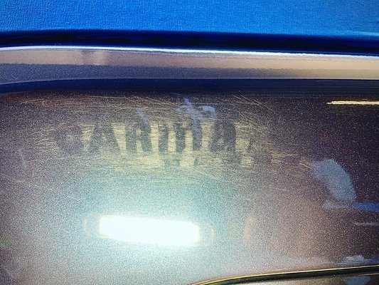 Scratch removal - Original owners of this 2015 Nissan Murano SV tried to take off the carmax sticker themselves and left a few light scratches. I first wiped down the area of the scratch, then I started with a 4000 grit sandpaper and started slowly wet sanding the area. After sanding I then used polished the area removing any scuff marks & just like magic you can’t even tell it was there !