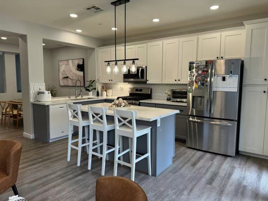 Full Home Remodel – Rancho Peñasquitos, San Diego, CA - This project was a full home remodel in the Rancho Peñasquitos area (92129). The entire house was transformed with new flooring, a complete kitchen remodel, and fully updated bathrooms.
In the kitchen, we installed new two-tone shaker cabinets (white uppers and gray lowers), quartz countertops, and widened the island for more prep and seating space. Both bathrooms received new vanities, quartz countertops, modern fixtures, and updated tile work. New recessed lighting and luxury vinyl plank flooring throughout the home made the space feel bright, warm, and cohesive.