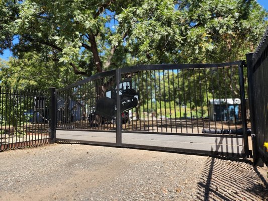 Custom Automatic gate & metal fence - This was a fun project! The client is in construction & their design for their gate was for it to make a statement. One of our favorites ! Custom Automatic gate & metal fence - This was a fun project! The client is in construction & their design for their gate was for it to make a statement. One of our favorites !