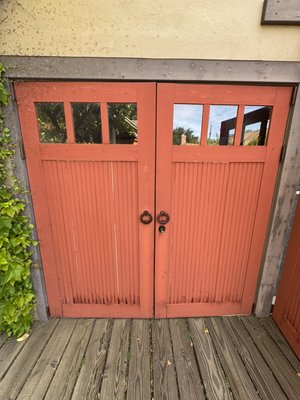 Door repair - We removed the doors, replaced the rotted and deteriorated vertical door components, replaced part of the door structure including the bottom rail, sealed all joints and gaps, and prepared the doors for painting. We also trimmed the doors to the required height and width, installed all necessary weatherstripping and sealing components, and adjusted the gaps for proper operation.