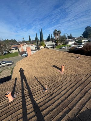 Before & after, GAF charcoal with valley metals - It delivers a bold, modern look while maximizing roof protection. The rich charcoal color enhances curb appeal, and durable metal valleys ensure superior water flow and long-lasting performance.