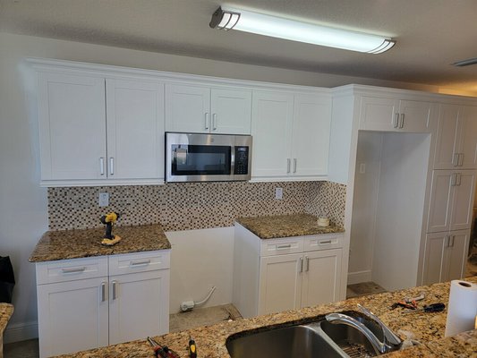 Cabinets from maple to white - We resurfaced and painted cabinets from a maple to white. Cabinets from maple to white - We resurfaced and painted cabinets from a maple to white.
