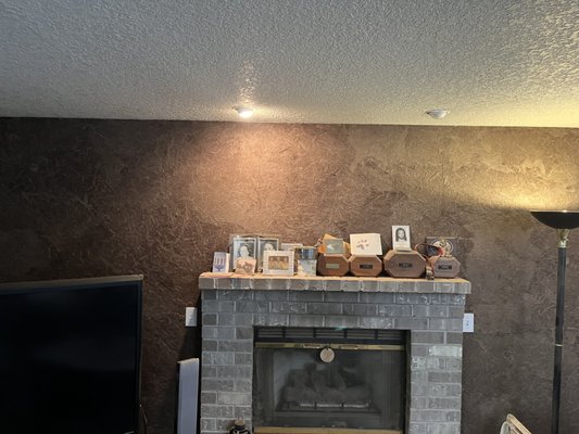 House up for sale - Before putting the house on the market, we noticed that a few walls needed a fresh coat of paint. One of the walls that required attention was the brown living room wall surrounding the fireplace. My son Cole and I took our time to prepare the area, ensuring that we kept the bricks protected. We applied three heavy coats of primer to cover the brown color and make it white again. The wall had a papier-mâché texture, which proved to be quite absorbent, requiring us to apply multiple layers of primer. House up for sale - Before putting the house on the market, we noticed that a few walls needed a fresh coat of paint. One of the walls that required attention was the brown living room wall surrounding the fireplace. My son Cole and I took our time to prepare the area, ensuring that we kept the bricks protected. We applied three heavy coats of primer to cover the brown color and make it white again. The wall had a papier-mâché texture, which proved to be quite absorbent, requiring us to apply multiple layers of primer.