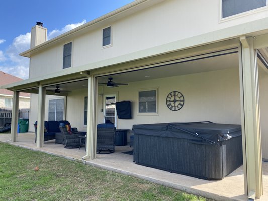 Pfugerville, TX - Solid Insulated Patio Cover - This customer wanted to enjoy their outdoor space by covering their TV, furniture, and new hot tub! We installed an aluminum based Solid Insulated Patio Cover, which will reduce radiant heat gain underneath the system and provide shade on those sunny days! Pfugerville, TX - Solid Insulated Patio Cover - This customer wanted to enjoy their outdoor space by covering their TV, furniture, and new hot tub! We installed an aluminum based Solid Insulated Patio Cover, which will reduce radiant heat gain underneath the system and provide shade on those sunny days!