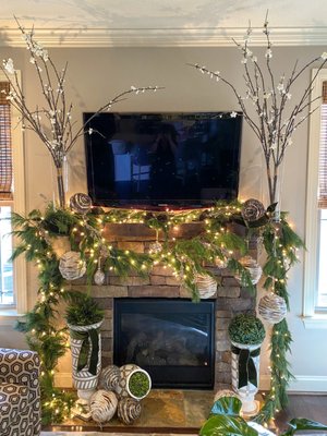 Christmas Fresh Evergreen Garland Fireplace Mantel - Client requested we only use fresh garlands, trees, and wreaths for her decor. Moss green velvet ribbons. Clear mini lights. Fresh green moss balls. Rustic round spheres hanging down. Christmas Fresh Evergreen Garland Fireplace Mantel - Client requested we only use fresh garlands, trees, and wreaths for her decor. Moss green velvet ribbons. Clear mini lights. Fresh green moss balls. Rustic round spheres hanging down.