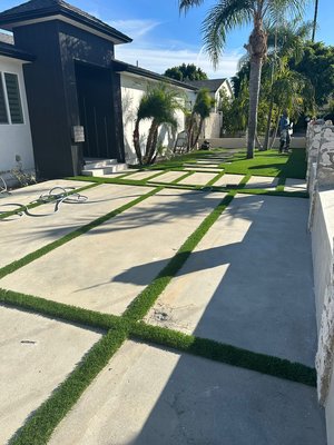 Front yard remodeling - Front yard and driveway construction with artificial turf, concrete squares, and compete landscape. Front yard remodeling - Front yard and driveway construction with artificial turf, concrete squares, and compete landscape.