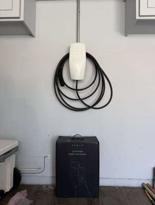 Tesla EV Charger Installation – Garage - Residential EV charger installation featuring a Tesla Universal Wall Connector. Spark Edge Power handled the electrical wiring, conduit installation, connections, and charger setup, delivering a clean and professional installation ready for reliable home EV charging.