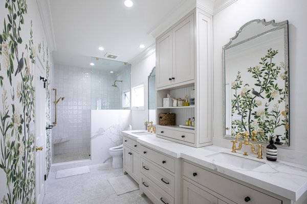 Three Bathroom Addition with Custom Layouts & Functional Design by SB Construction & Remodeling in Long Beach, CA - At SB Construction & Remodeling in Long Beach, CA, we completed this custom three bathroom addition with the goal of expanding the home's functionality while giving each bathroom its own unique identity. Rather than repeating the same design throughout, we carefully planned each space to reflect a different style, ensuring every bathroom complements its intended use while maintaining a cohesive look across the home.
The first bathroom was designed with a sophisticated transitional style that blends timeless elegance with bold design elements. Rich blue wall tile, decorative botanical wallpaper, and warm brass accents create a striking visual contrast, while the custom vanity, walk-in shower, and thoughtfully planned storage provide everyday functionality. The layered textures and balanced color palette make this space feel refined, welcoming, and full of character.
The second bathroom embraces a bright coastal-inspired aesthetic with cheerful colors and playful details. A custom double vanity provides ample space for daily routines, while the tub and shower combination offers versatility for family living. Soft blue tones, decorative wallpaper, and carefully selected fixtures create a light, refreshing atmosphere that feels comfortable, functional, and inviting.
The third bathroom was designed as a spa-inspired retreat that prioritizes relaxation and comfort. A spacious walk-in shower, freestanding soaking tub, and custom vanity establish an open, luxurious layout, while decorative wall treatments, elegant lighting, and carefully coordinated finishes create a calming environment. The combination of generous space planning and timeless design gives this bathroom a refined yet welcoming feel.
Although each bathroom showcases its own personality, the overall project was unified through thoughtful space planning, cohesive design principles, and meticulous craftsmanship. Every layout was carefully developed to maximize functionality, improve daily comfort, and create beautiful spaces that integrate seamlessly with the home's overall design.
Project Highlights:
Three custom-designed bathroom additions
Individually designed layouts tailored to each space
Walk-in showers and a freestanding soaking tub
Custom single and double vanity configurations
Frameless glass shower enclosures
Decorative wall treatments and curated color palettes
Functional storage solutions and efficient space planning
Timeless designs with premium craftsmanship throughout
Whether you're adding a single bathroom or planning a complete home expansion, contact SB Construction & Remodeling today to schedule a consultation. Three Bathroom Addition with Custom Layouts & Functional Design by SB Construction & Remodeling in Long Beach, CA - At SB Construction & Remodeling in Long Beach, CA, we completed this custom three bathroom addition with the goal of expanding the home's functionality while giving each bathroom its own unique identity. Rather than repeating the same design throughout, we carefully planned each space to reflect a different style, ensuring every bathroom complements its intended use while maintaining a cohesive look across the home.
The first bathroom was designed with a sophisticated transitional style that blends timeless elegance with bold design elements. Rich blue wall tile, decorative botanical wallpaper, and warm brass accents create a striking visual contrast, while the custom vanity, walk-in shower, and thoughtfully planned storage provide everyday functionality. The layered textures and balanced color palette make this space feel refined, welcoming, and full of character.
The second bathroom embraces a bright coastal-inspired aesthetic with cheerful colors and playful details. A custom double vanity provides ample space for daily routines, while the tub and shower combination offers versatility for family living. Soft blue tones, decorative wallpaper, and carefully selected fixtures create a light, refreshing atmosphere that feels comfortable, functional, and inviting.
The third bathroom was designed as a spa-inspired retreat that prioritizes relaxation and comfort. A spacious walk-in shower, freestanding soaking tub, and custom vanity establish an open, luxurious layout, while decorative wall treatments, elegant lighting, and carefully coordinated finishes create a calming environment. The combination of generous space planning and timeless design gives this bathroom a refined yet welcoming feel.
Although each bathroom showcases its own personality, the overall project was unified through thoughtful space planning, cohesive design principles, and meticulous craftsmanship. Every layout was carefully developed to maximize functionality, improve daily comfort, and create beautiful spaces that integrate seamlessly with the home's overall design.
Project Highlights:
Three custom-designed bathroom additions
Individually designed layouts tailored to each space
Walk-in showers and a freestanding soaking tub
Custom single and double vanity configurations
Frameless glass shower enclosures
Decorative wall treatments and curated color palettes
Functional storage solutions and efficient space planning
Timeless designs with premium craftsmanship throughout
Whether you're adding a single bathroom or planning a complete home expansion, contact SB Construction & Remodeling today to schedule a consultation.
