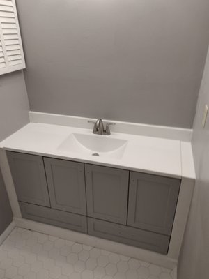 Bathroom Remodel & Plumbing Job. - We ripped out the water damaged wall and updated the plumbing with PEX leads and a new PVC toilet flange.
Then replaced the drywall and finished the seams and textured the walls. Installed the vanity and trim the painted with a modern scheme of pure white and an elegant, lightened gray.
To finish we installed a beautiful white covered base toilet. Bathroom Remodel & Plumbing Job. - We ripped out the water damaged wall and updated the plumbing with PEX leads and a new PVC toilet flange.
Then replaced the drywall and finished the seams and textured the walls. Installed the vanity and trim the painted with a modern scheme of pure white and an elegant, lightened gray.
To finish we installed a beautiful white covered base toilet.