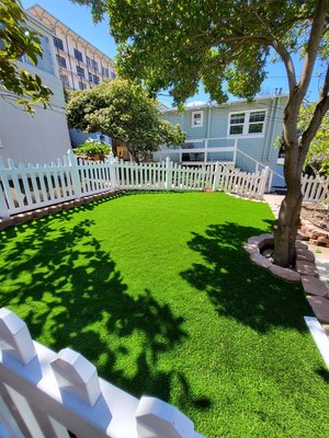Artificial grass install - This is a front yard makeover, making it look green and low maintenance.