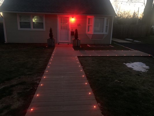 Flush in-deck LED lights plus a nice relaxing walkway - The customer used to have a concrete walkway to the street. He was old and boring. We wanted to bring some nature and curb appeal to the front of the home. So we decided to do a natural wood deck like front walkway. But we did not stop there as we wanted to go one step above and ad LED lights and custom planters to tie everything together. Flush in-deck LED lights plus a nice relaxing walkway - The customer used to have a concrete walkway to the street. He was old and boring. We wanted to bring some nature and curb appeal to the front of the home. So we decided to do a natural wood deck like front walkway. But we did not stop there as we wanted to go one step above and ad LED lights and custom planters to tie everything together.
