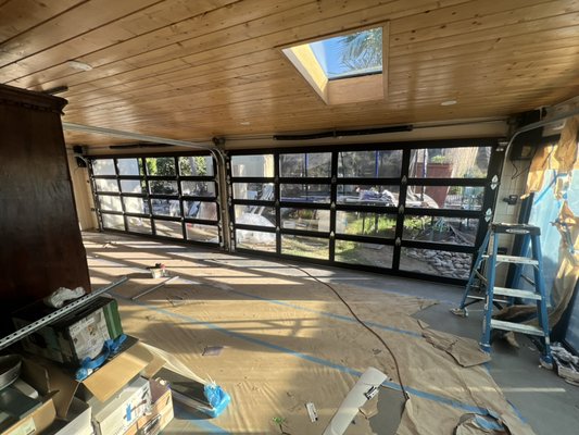 Backyard Patio Sanctuary - This Bay Park patio was completely redone on the interior and exterior.  Complemented by two Clopay Avante Garage Doors with Liftmaster 98022-Side Mount Motors. Call us today to see what we can do for your patio space!