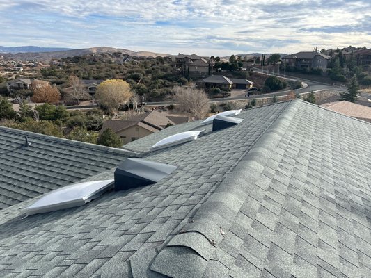 Residential Roof Replacement Prescott AZ - Welcome to our exclusive portfolio featuring a 50 Square GAF HDZ shingle in the color, Slate. Elevate your roofing experience with a system that not only embodies elegance and sophistication but also guarantees unparalleled durability and performance.
Key Features:
GAF HDZ Slate: Immerse yourself in the timeless beauty of 50 squares of GAF HDZ Slate, a masterpiece in roofing design. Crafted with precision, these shingles offer a stunning aesthetic that enhances the overall appeal of your property.
Exclusive Warranties: Our commitment to excellence extends beyond the ordinary. Experience peace of mind with our exclusive warranties, tailored to offer you unmatched protection. We prioritize your satisfaction and stand by the quality of our products and services.
All-New Vents and Skylights: Enhance the functionality and ambiance of your space with our all-new vents and skylights. Designed for optimal ventilation and natural light, these additions not only improve indoor comfort but also add a touch of sophistication to your property.
Whether you are building a new home or upgrading your existing roof, our 50 Square GAF HDZ Slate portfolio with the System Plus Warranty is a testament to our dedication to delivering roofing solutions that blend aesthetics with durability. Choose us for an elevated roofing experience that exceeds expectations. Residential Roof Replacement Prescott AZ - Welcome to our exclusive portfolio featuring a 50 Square GAF HDZ shingle in the color, Slate. Elevate your roofing experience with a system that not only embodies elegance and sophistication but also guarantees unparalleled durability and performance.
Key Features:
GAF HDZ Slate: Immerse yourself in the timeless beauty of 50 squares of GAF HDZ Slate, a masterpiece in roofing design. Crafted with precision, these shingles offer a stunning aesthetic that enhances the overall appeal of your property.
Exclusive Warranties: Our commitment to excellence extends beyond the ordinary. Experience peace of mind with our exclusive warranties, tailored to offer you unmatched protection. We prioritize your satisfaction and stand by the quality of our products and services.
All-New Vents and Skylights: Enhance the functionality and ambiance of your space with our all-new vents and skylights. Designed for optimal ventilation and natural light, these additions not only improve indoor comfort but also add a touch of sophistication to your property.
Whether you are building a new home or upgrading your existing roof, our 50 Square GAF HDZ Slate portfolio with the System Plus Warranty is a testament to our dedication to delivering roofing solutions that blend aesthetics with durability. Choose us for an elevated roofing experience that exceeds expectations.