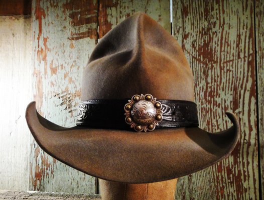 WESTERN CUSTOM COWBOY HATS - Lonesome Cowboy Ranch works with vintage, yet mint condition hats and reshapes and adds custom bands/conchos. We have two hat ranges; the 'No Sweat' custom shaped and distressed to look trail worn. We do the sweating, you do the wearing! The second range is call the 'Manta Wave'. These are high quality, mint condition vintage hats that we re-shape, add custom bands and are styled after the Old West movies. For example, the first picture was created to match Kevin Costner's hat in the movie "Open Range". All the hats we redesign are one of a kind, like people! WESTERN CUSTOM COWBOY HATS - Lonesome Cowboy Ranch works with vintage, yet mint condition hats and reshapes and adds custom bands/conchos. We have two hat ranges; the 'No Sweat' custom shaped and distressed to look trail worn. We do the sweating, you do the wearing! The second range is call the 'Manta Wave'. These are high quality, mint condition vintage hats that we re-shape, add custom bands and are styled after the Old West movies. For example, the first picture was created to match Kevin Costner's hat in the movie "Open Range". All the hats we redesign are one of a kind, like people!