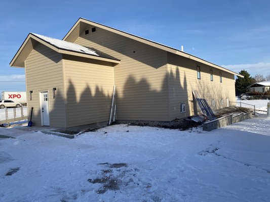 Church Siding Project - Before and after of a church exterior siding project. The building was first prepped with proper sheathing and weather barrier to ensure long-term moisture protection. New siding and trim were then installed to give the church a clean, durable exterior designed to handle Montana’s changing weather while improving the overall look of the building.