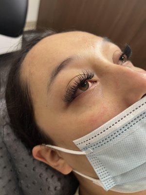 Hybrid Eyelash Extension - Hybrid lashes take the pressure out of choosing between the long, dense, and dark look, and the light, wispy, and natural look. With Hybrid lashes, you can have your cake and eat it too! This style is perfect for those looking for both the dark mascara-esque classic lash look and dense volume lashes.