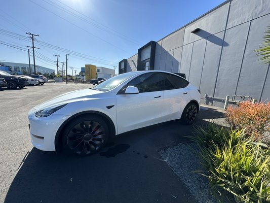 Tesla model Y - This customer wanted his front two windows color matched to the rear factory glass we added some 20% tint our most popular shade ! Another highly satisfied customer