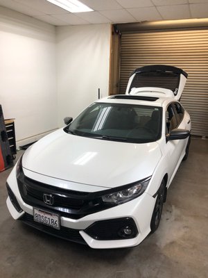 2018 Honda Civic EX Roof Wrap - This white 10th gen Honda Civic wanted their roof wrapped gloss black to achieve a "panda" look for his car. The antenna of the car had to be removed to lay this vinyl cleanly which involved partially removing the headliner. We wrapped this Civic's roof with gloss black Avery brand vinyl. 2018 Honda Civic EX Roof Wrap - This white 10th gen Honda Civic wanted their roof wrapped gloss black to achieve a "panda" look for his car. The antenna of the car had to be removed to lay this vinyl cleanly which involved partially removing the headliner. We wrapped this Civic's roof with gloss black Avery brand vinyl.
