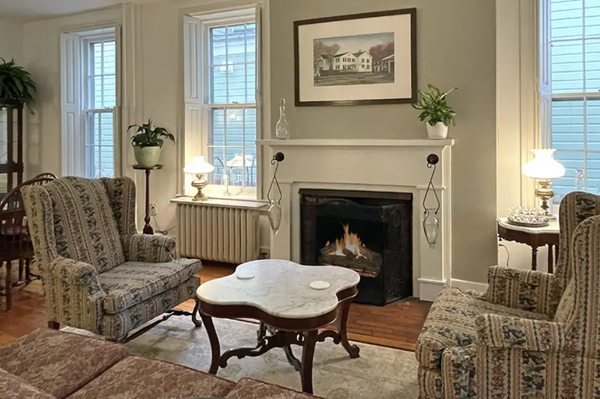The Parlor - Across the hall from the lounge, on the right as you enter the Inn, you will find the large dining parlor. This room has a comfortable sitting area in front of the working fireplace to relax, read or converse, and two dining tables upon which to enjoy a beverage or game. Coffee, tea and various other hot and cold beverages are available here throughout the day. The dining parlor is where breakfast will be served. The Parlor - Across the hall from the lounge, on the right as you enter the Inn, you will find the large dining parlor. This room has a comfortable sitting area in front of the working fireplace to relax, read or converse, and two dining tables upon which to enjoy a beverage or game. Coffee, tea and various other hot and cold beverages are available here throughout the day. The dining parlor is where breakfast will be served.