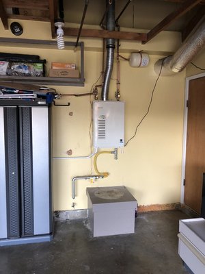 Tankless water heater installation - Removal of old water heater and installation of new tankless water heater Tankless water heater installation - Removal of old water heater and installation of new tankless water heater