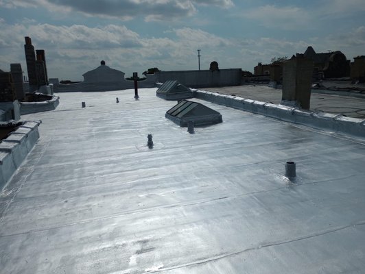 Flat roof replacement - Tear off existing flat roof , installed new material .