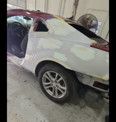 Chevy Camaro Repair and Paint - Cut and Removed the old panel. precise cuts, trimmed ,clean and installed the new panel. made sure all gaps were to OEM spec. started welding the panel. after finishing I added body filler to form and blend to the original panel and filled a few spots with dents, which then after it was ready for prime and paint.