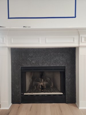 Fireplace Tile Transformation - The customer completed a demo of their old fireplace tile. I was asked to come in and complete their herringbone tile installation. This has totally transformed their living area! Fireplace Tile Transformation - The customer completed a demo of their old fireplace tile. I was asked to come in and complete their herringbone tile installation. This has totally transformed their living area!