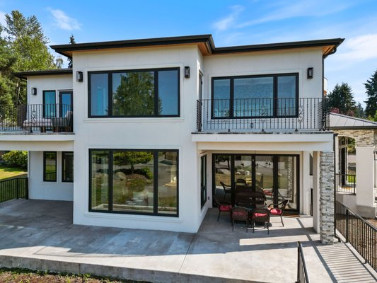 Luxurious Coastal Residence - Welcome to a bespoke luxury remodel that seamlessly blends classic elegance with modern sophistication, set against the serene backdrop of coastal views. This extensive renovation project covers key areas of a spacious residence, including a stunning kitchen, multiple bathrooms, a grand entryway, and elegant living spaces. Each design element and architectural feature has been meticulously chosen to enhance the home's unique character while providing contemporary comfort and style.
The heart of the home features a spacious, open-plan kitchen equipped with state-of-the-art appliances and a large central island topped with a sleek, dark granite counter. White shaker-style cabinets complemented by modern hardware offer ample storage, while custom glass-fronted cabinets add a touch of elegance. The backsplash in a subtle geometric pattern adds depth and interest to the clean, bright aesthetic. This space is perfect for both daily family use and large gatherings, with natural light flooding in through large windows that offer picturesque views.
The master bathroom is a sanctuary of relaxation, featuring a freestanding bathtub, a large glass-enclosed shower, and dual vanity sinks set against a backdrop of mixed wood-look and marble tiles, creating a spa-like atmosphere. Additional bathrooms mirror this luxury with high-end fittings and unique design touches such as bespoke wallpaper and custom lighting fixtures, ensuring each space is both functional and visually stunning.
Living spaces are designed to be both welcoming and stylish, with plush seating, elegant decor, and expansive windows that frame the breathtaking coastal scenery. A particular highlight is the living room, which opens onto a balcony, offering an indoor-outdoor living experience that takes full advantage of the home’s location.
A dramatic entryway sets the tone with a sweeping staircase featuring decorative iron railings and a series of windows that infuse the space with natural light. The foyer leads into a bright, open interior, grounded by rich hardwood flooring that flows seamlessly throughout the residence.
The remodel includes several standout features, such as a custom-built wine storage area visible from the kitchen and living room, adding an element of luxury and convenience. The property also includes a dedicated bar area with a unique honeycomb backsplash and modern fixtures, perfect for entertaining.
Attention to detail extends to the exterior and structural enhancements, including sophisticated landscaping and modernized facades that elevate the home's curb appeal. Advanced materials and techniques have been used to ensure durability and energy efficiency, aligning with contemporary standards for luxury living.
This Home is more than just a renovation; it's a transformation into a modern sanctuary that respects and enhances the existing architectural beauty. Ideal for discerning homeowners looking for a turnkey solution to luxury coastal living, this project promises comfort, elegance, and a connection to the stunning natural surroundings. Luxurious Coastal Residence - Welcome to a bespoke luxury remodel that seamlessly blends classic elegance with modern sophistication, set against the serene backdrop of coastal views. This extensive renovation project covers key areas of a spacious residence, including a stunning kitchen, multiple bathrooms, a grand entryway, and elegant living spaces. Each design element and architectural feature has been meticulously chosen to enhance the home's unique character while providing contemporary comfort and style.
The heart of the home features a spacious, open-plan kitchen equipped with state-of-the-art appliances and a large central island topped with a sleek, dark granite counter. White shaker-style cabinets complemented by modern hardware offer ample storage, while custom glass-fronted cabinets add a touch of elegance. The backsplash in a subtle geometric pattern adds depth and interest to the clean, bright aesthetic. This space is perfect for both daily family use and large gatherings, with natural light flooding in through large windows that offer picturesque views.
The master bathroom is a sanctuary of relaxation, featuring a freestanding bathtub, a large glass-enclosed shower, and dual vanity sinks set against a backdrop of mixed wood-look and marble tiles, creating a spa-like atmosphere. Additional bathrooms mirror this luxury with high-end fittings and unique design touches such as bespoke wallpaper and custom lighting fixtures, ensuring each space is both functional and visually stunning.
Living spaces are designed to be both welcoming and stylish, with plush seating, elegant decor, and expansive windows that frame the breathtaking coastal scenery. A particular highlight is the living room, which opens onto a balcony, offering an indoor-outdoor living experience that takes full advantage of the home’s location.
A dramatic entryway sets the tone with a sweeping staircase featuring decorative iron railings and a series of windows that infuse the space with natural light. The foyer leads into a bright, open interior, grounded by rich hardwood flooring that flows seamlessly throughout the residence.
The remodel includes several standout features, such as a custom-built wine storage area visible from the kitchen and living room, adding an element of luxury and convenience. The property also includes a dedicated bar area with a unique honeycomb backsplash and modern fixtures, perfect for entertaining.
Attention to detail extends to the exterior and structural enhancements, including sophisticated landscaping and modernized facades that elevate the home's curb appeal. Advanced materials and techniques have been used to ensure durability and energy efficiency, aligning with contemporary standards for luxury living.
This Home is more than just a renovation; it's a transformation into a modern sanctuary that respects and enhances the existing architectural beauty. Ideal for discerning homeowners looking for a turnkey solution to luxury coastal living, this project promises comfort, elegance, and a connection to the stunning natural surroundings.