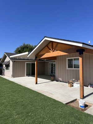 Back Yard Remodel - This backyard transformation included new roof on home, extended patio with gabled roof. Added an Weatherwood aluminum cover in between roof lines to maximize patio area. This project also included new concrete patio, Fencing, Sod & Irrigation.