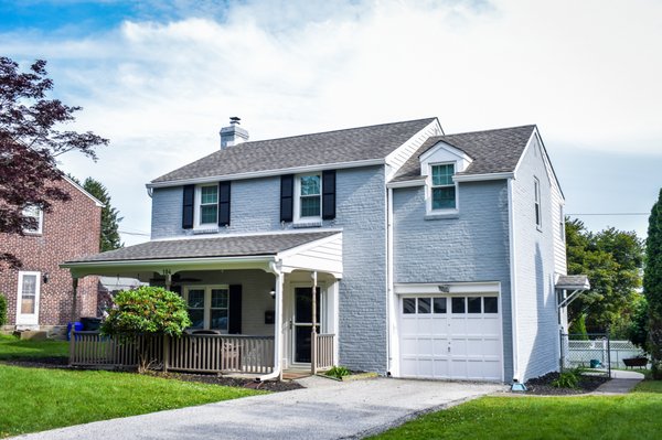 Exterior Painting - Drexel Hill, PA - We were trusted to paint the entirety of this ~2,500 square feet place in Drexel Hill, PA. We took 5 days to complete the exterior of this place from a pink color to this beautiful, contemporaneous gray. We complemented the look with the painting of the shutters, gutters and front door in black, with a white trim to make it look good. Exterior Painting - Drexel Hill, PA - We were trusted to paint the entirety of this ~2,500 square feet place in Drexel Hill, PA. We took 5 days to complete the exterior of this place from a pink color to this beautiful, contemporaneous gray. We complemented the look with the painting of the shutters, gutters and front door in black, with a white trim to make it look good.