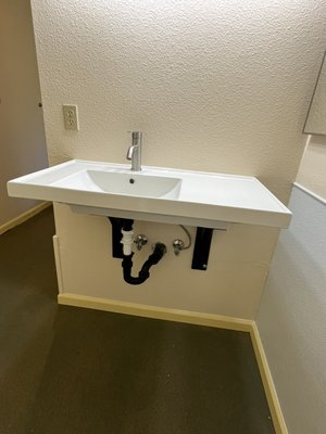 Bathroom remodel - On this project our customer wanted a light Bathroom Remodel. The sink was leaking and severely damaged the drywall. We made all of the necessary repairs and also installed new baseboards. The entire bathroom was also painted.