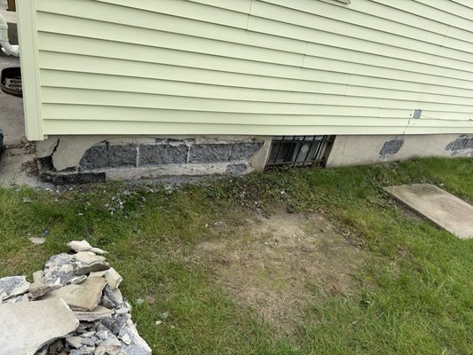 Wall.    Exterior wall parging and interior French drain sump pump and basin - Wall parging and French drain system.foundation walls were in very bad condition old French drain system wasn’t working visible mold in the back