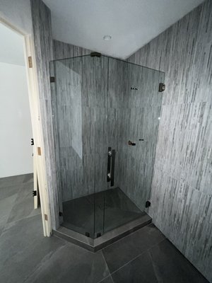 Shower remodel - This shower remodel consist of 3/8” clear tempered glass with square hardware in a brush nickel finish Shower remodel - This shower remodel consist of 3/8” clear tempered glass with square hardware in a brush nickel finish