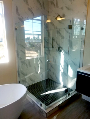 FRAMELESS GLASS SHOWER DOORS AND ENCLOSURES - Frameless glass shower doors or shower enclosures, that encompass the entire space around your shower pan and drain, are an option worth considering when updating an existing bathroom, remodeling and/or building a new bathroom space.
Custom made to fit your existing shower or tub area or to your design specifications, these frameless doors/enclosures add a modern contemporary esthetic to your bathroom design.
One of the most important aspects of choosing frameless glass for your tub or shower area is accurate glass measurements and hiring an experienced professional installer. Economy Glass Services has completed numerous installations of custom frameless shower doors and enclosures which have exceeded our client’s expectations. FRAMELESS GLASS SHOWER DOORS AND ENCLOSURES - Frameless glass shower doors or shower enclosures, that encompass the entire space around your shower pan and drain, are an option worth considering when updating an existing bathroom, remodeling and/or building a new bathroom space.
Custom made to fit your existing shower or tub area or to your design specifications, these frameless doors/enclosures add a modern contemporary esthetic to your bathroom design.
One of the most important aspects of choosing frameless glass for your tub or shower area is accurate glass measurements and hiring an experienced professional installer. Economy Glass Services has completed numerous installations of custom frameless shower doors and enclosures which have exceeded our client’s expectations.