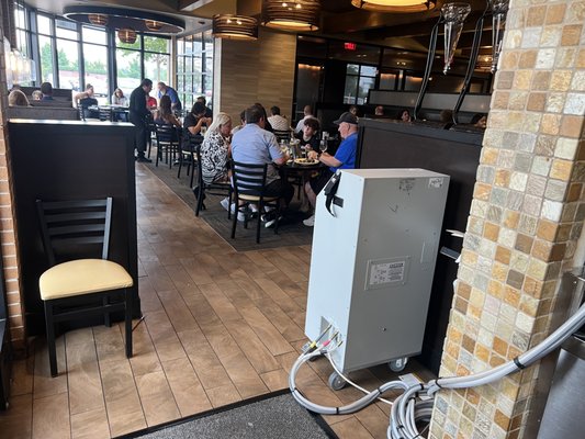 Restaurant Seating Area Cooling Rental - Barrington, IL restaurants who serve food and beverages to dine in customers will lose revenue if the climate control conditions within the restaurant are not comfortable. Customer initial presentation when they walk in the door are important. Customers will walk in the restaurant, notice an uncontrolled environment, and head to another restaurant location where they have cooling comfort. Sometimes budgets prevent the manager from implementing the entire cooling plan which can be costly. In this temporary cooling application, a section of the restaurant seating was closed to accommodate the budget. Depending on the urgency of temporary AC, installation of the AC often takes place when the restaurant is closed. Routing of exhaust ducts or water hoses can be extensive to avoid trip hazards. No matter what, we at “Rent AC” will accommodate your installation schedule. Restaurant Seating Area Cooling Rental - Barrington, IL restaurants who serve food and beverages to dine in customers will lose revenue if the climate control conditions within the restaurant are not comfortable. Customer initial presentation when they walk in the door are important. Customers will walk in the restaurant, notice an uncontrolled environment, and head to another restaurant location where they have cooling comfort. Sometimes budgets prevent the manager from implementing the entire cooling plan which can be costly. In this temporary cooling application, a section of the restaurant seating was closed to accommodate the budget. Depending on the urgency of temporary AC, installation of the AC often takes place when the restaurant is closed. Routing of exhaust ducts or water hoses can be extensive to avoid trip hazards. No matter what, we at “Rent AC” will accommodate your installation schedule.