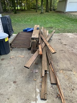 Deck Debris Clean Up - We removed the debris of an old deck and a few other miscellaneous items. We made sure to sweep the driveway of any debris that was left behind!