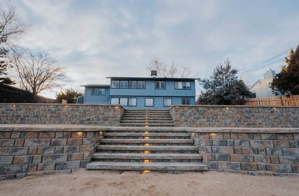 Transformation: Concrete Driveway, Spacious Patio, and Tiered Retaining Walls - Project Overview:
In our latest project, we took on the challenge of transforming a sloped property into a functional and visually appealing outdoor space. The project included the construction of a concrete driveway for improved access, a spacious patio designed for BBQs and gatherings, two tiered retaining walls to maximize hillside space, steps for easy navigation between levels, and compacted decomposed granite (DG) areas for a natural aesthetic. Our goal was to create a durable and attractive outdoor area that meets our client's needs for accessibility, entertainment, and beauty.
Features Implemented:
Concrete Driveway: We constructed a durable concrete driveway that winds down the hill, providing future access to the property. This feature was designed to handle the slope efficiently while ensuring safety and enhancing the property's overall accessibility.
Larger Patio Area: At the heart of the outdoor space, we crafted a larger patio area, perfect for BBQs, family gatherings, and outdoor entertainment. This expansive patio serves as a versatile space for hosting events or enjoying quiet evenings under the stars.
Two Tiered Retaining Walls: To effectively utilize the sloped terrain, we built two tiered retaining walls. These structures not only maximize the usable hillside space but also add an element of architectural interest. The retaining walls were carefully constructed to ensure stability and longevity.
Steps Between Levels: Integrating steps between the retaining wall tiers, we provided a seamless and aesthetically pleasing way to navigate the hillside. These steps ensure easy access to all levels of the outdoor space, enhancing functionality and safety.
Compacted Decomposed Granite (DG): For areas surrounding the retaining walls and steps, we used compacted DG to create low-maintenance, natural-looking pathways and spaces. This material complements the landscape's aesthetic while providing a durable surface for foot traffic.
Project Challenges and Solutions:
The primary challenge of this project was designing and constructing features that would seamlessly integrate with the sloped terrain, ensuring durability and usability. By implementing tiered retaining walls and a carefully planned driveway, we were able to maximize the space effectively. Our solution-oriented approach allowed us to overcome the complexities of the hillside, resulting in a cohesive and functional outdoor area.
Conclusion:
This project highlights our expertise in transforming challenging landscapes into beautiful, functional outdoor living spaces. With the addition of a concrete driveway, a spacious patio for gatherings, tiered retaining walls, and more, we've created a hillside oasis that exceeds our client's expectations for both utility and style.
Contact Us:
Are you looking to enhance your outdoor space? Contact us today to discuss how we can bring your vision to life, no matter the challenges your landscape may present. Transformation: Concrete Driveway, Spacious Patio, and Tiered Retaining Walls - Project Overview:
In our latest project, we took on the challenge of transforming a sloped property into a functional and visually appealing outdoor space. The project included the construction of a concrete driveway for improved access, a spacious patio designed for BBQs and gatherings, two tiered retaining walls to maximize hillside space, steps for easy navigation between levels, and compacted decomposed granite (DG) areas for a natural aesthetic. Our goal was to create a durable and attractive outdoor area that meets our client's needs for accessibility, entertainment, and beauty.
Features Implemented:
Concrete Driveway: We constructed a durable concrete driveway that winds down the hill, providing future access to the property. This feature was designed to handle the slope efficiently while ensuring safety and enhancing the property's overall accessibility.
Larger Patio Area: At the heart of the outdoor space, we crafted a larger patio area, perfect for BBQs, family gatherings, and outdoor entertainment. This expansive patio serves as a versatile space for hosting events or enjoying quiet evenings under the stars.
Two Tiered Retaining Walls: To effectively utilize the sloped terrain, we built two tiered retaining walls. These structures not only maximize the usable hillside space but also add an element of architectural interest. The retaining walls were carefully constructed to ensure stability and longevity.
Steps Between Levels: Integrating steps between the retaining wall tiers, we provided a seamless and aesthetically pleasing way to navigate the hillside. These steps ensure easy access to all levels of the outdoor space, enhancing functionality and safety.
Compacted Decomposed Granite (DG): For areas surrounding the retaining walls and steps, we used compacted DG to create low-maintenance, natural-looking pathways and spaces. This material complements the landscape's aesthetic while providing a durable surface for foot traffic.
Project Challenges and Solutions:
The primary challenge of this project was designing and constructing features that would seamlessly integrate with the sloped terrain, ensuring durability and usability. By implementing tiered retaining walls and a carefully planned driveway, we were able to maximize the space effectively. Our solution-oriented approach allowed us to overcome the complexities of the hillside, resulting in a cohesive and functional outdoor area.
Conclusion:
This project highlights our expertise in transforming challenging landscapes into beautiful, functional outdoor living spaces. With the addition of a concrete driveway, a spacious patio for gatherings, tiered retaining walls, and more, we've created a hillside oasis that exceeds our client's expectations for both utility and style.
Contact Us:
Are you looking to enhance your outdoor space? Contact us today to discuss how we can bring your vision to life, no matter the challenges your landscape may present.